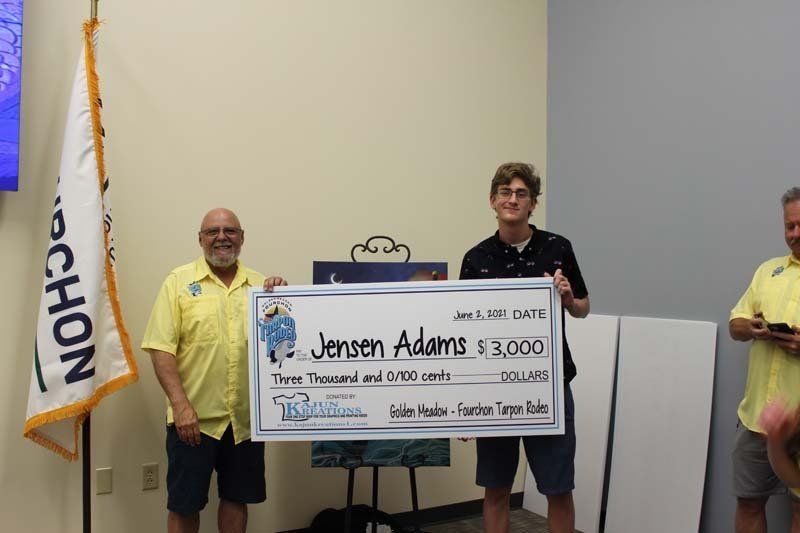 A man is holding a check that says jensen adams $ 3,000