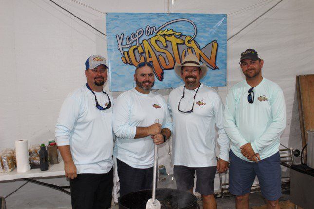 A group of men standing in front of a sign that says casta