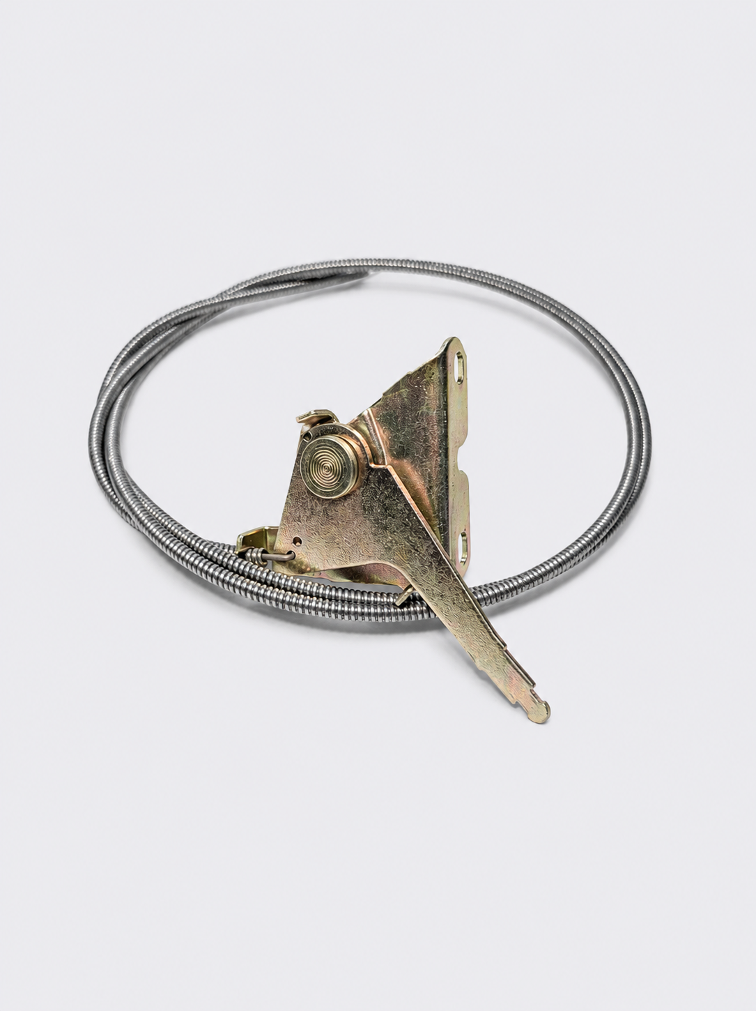 Coiled silver wire with a small triangular metal charm and a pointed pendant on a white background