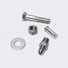 Assorted metal fasteners: bolt, nut, washer, pin, and threaded fitting on a white background