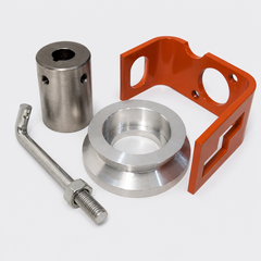 Metal hardware parts: silver cylinder, ring, hex bolt, and orange L-bracket on a white background