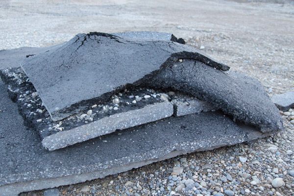 A pile of asphalt is laying on the ground.