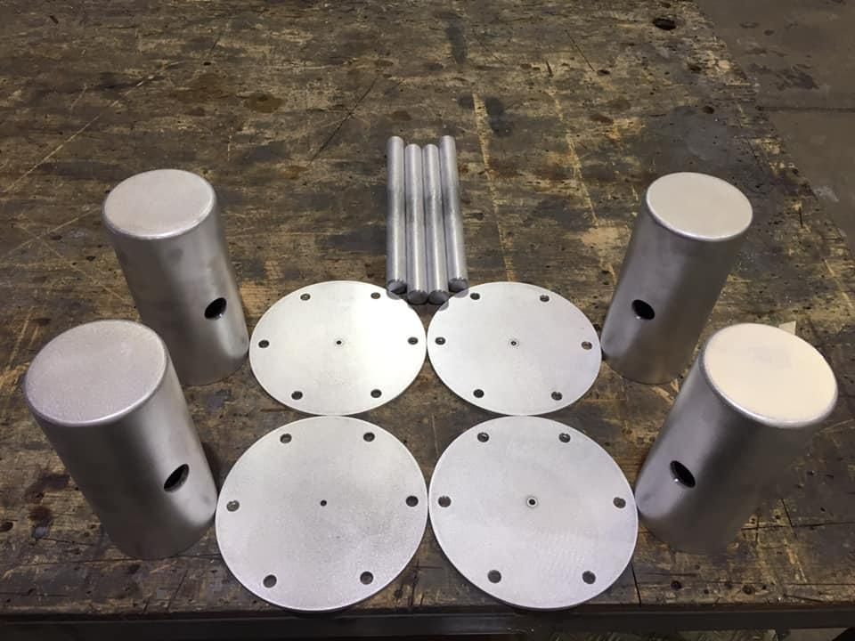 A Bunch of Metal Cylinders and Circles on A Table — Shearwater Engineering in Gloucester, NSW