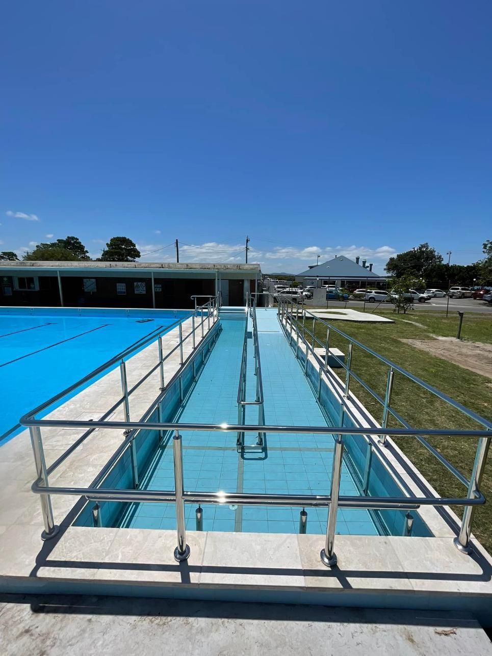 A Swimming Pool with A Metal Railing Surrounding It — Shearwater Engineering in Gloucester, NSW