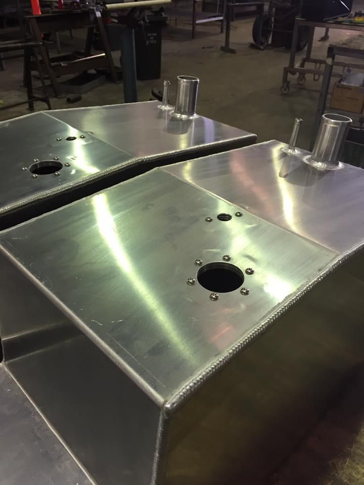 A Couple of Aluminium Tanks Sitting on Top of Each Other on A Table — Shearwater Engineering in Forster, NSW