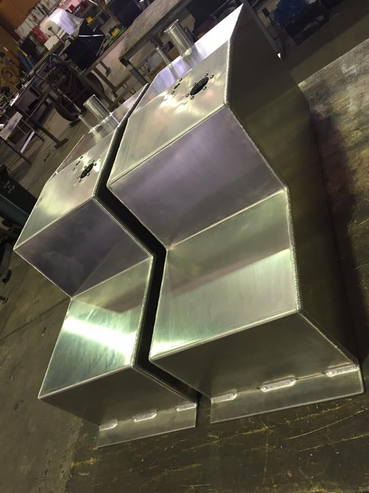 Two Aluminium Containers Are Sitting Side By Side — Shearwater Engineering in Taree, NSW