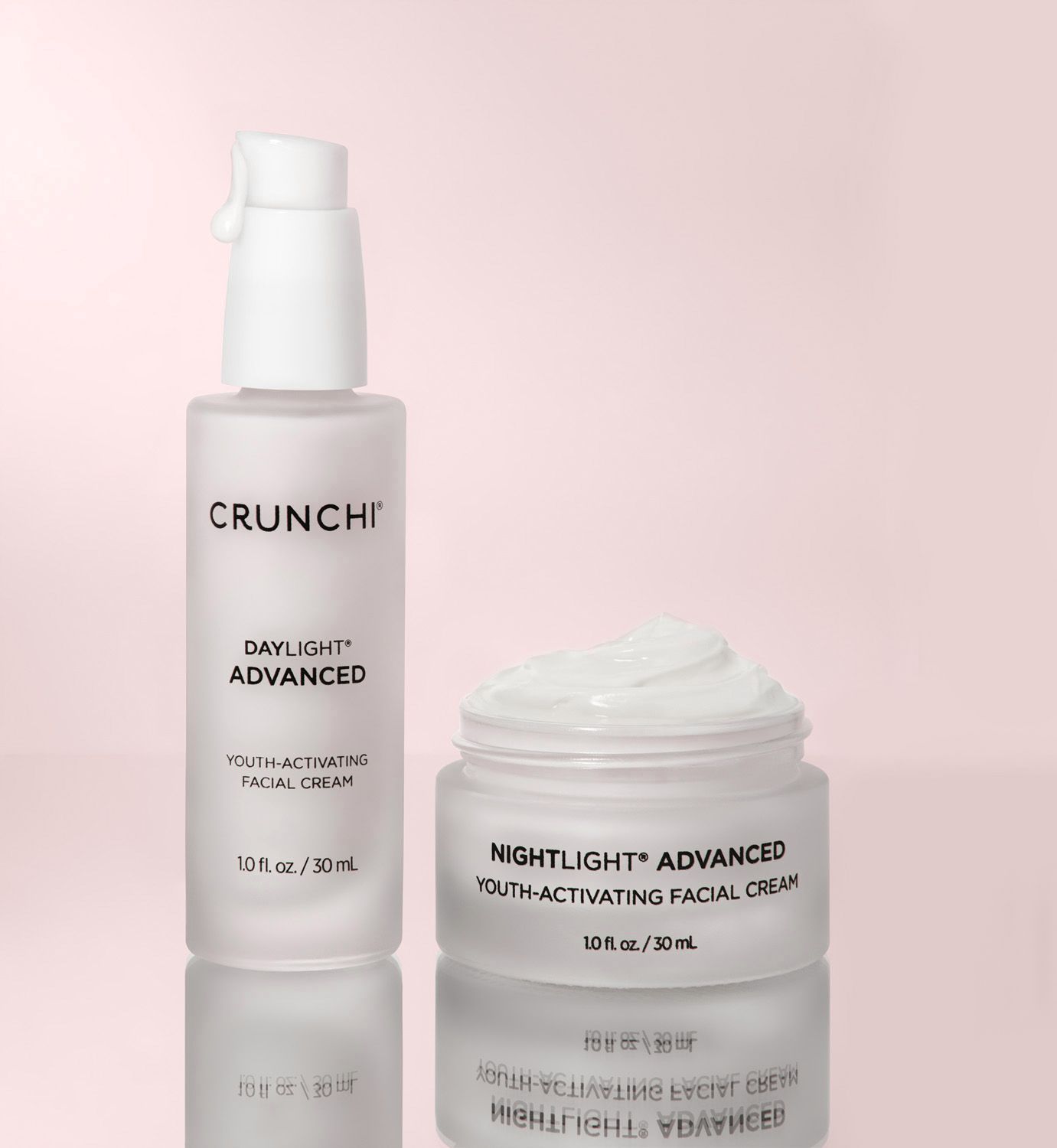 A bottle of tru aura night cream is sitting on a white cloth