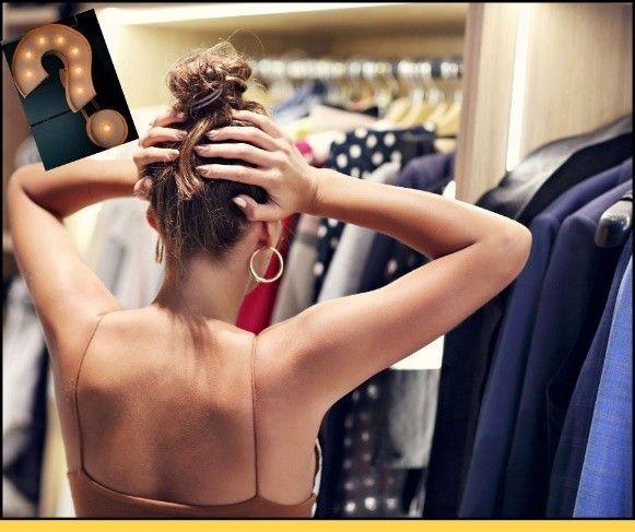 A woman is standing in a closet with a question mark in the background.