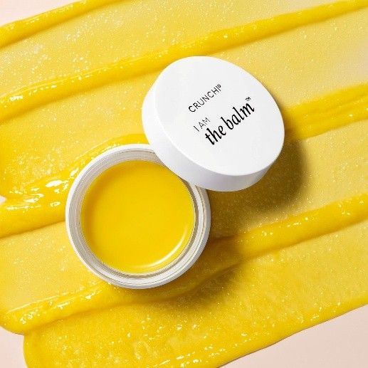 A group of TruAura Skincare bottles sitting on top of a table.