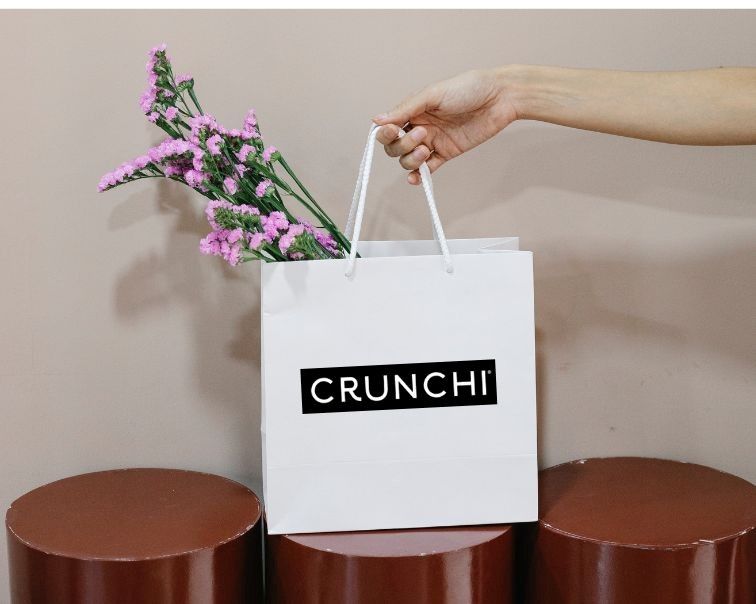 A white shopping bag with the black 