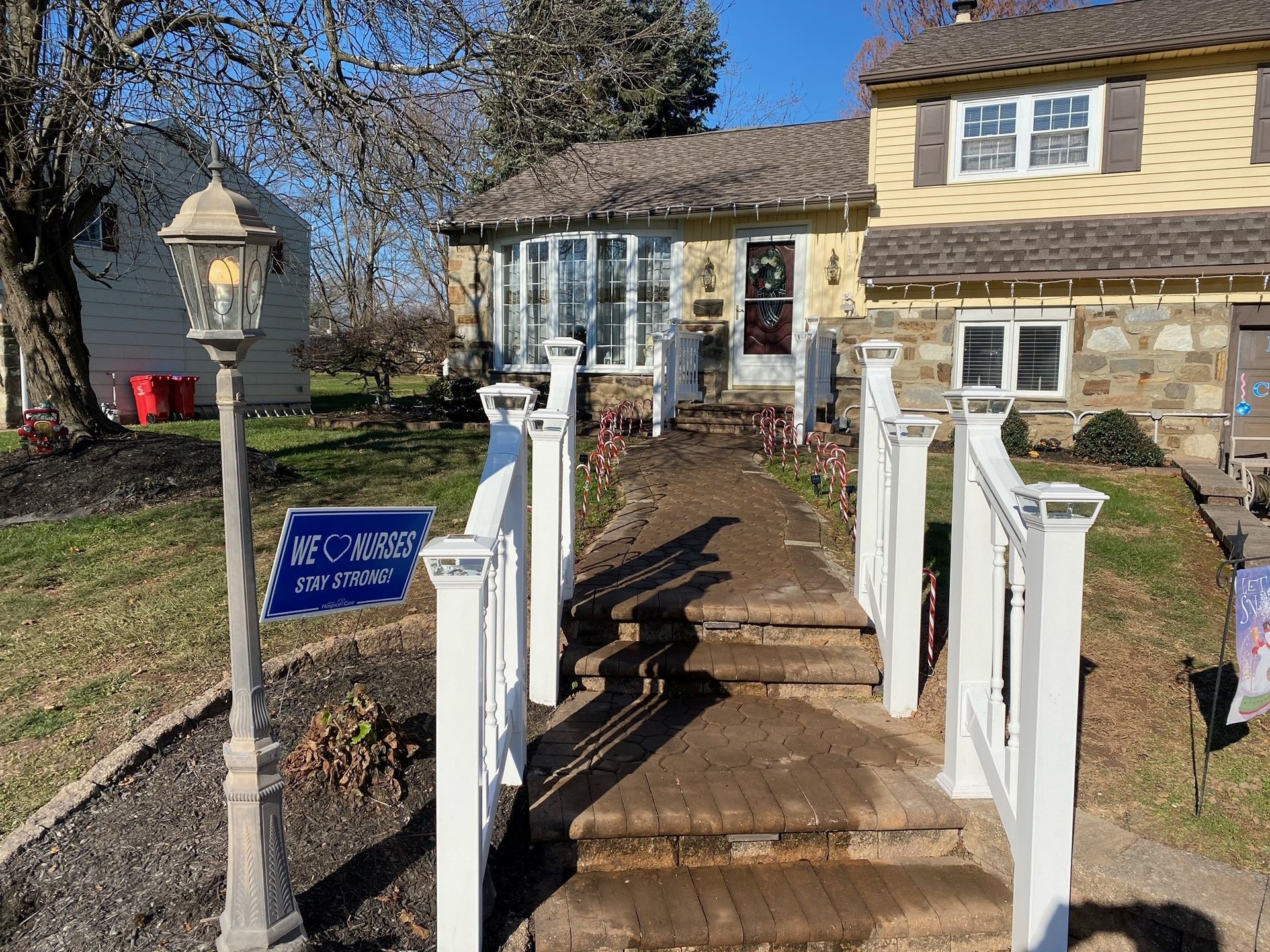 A house with stairs leading up to it is for sale.