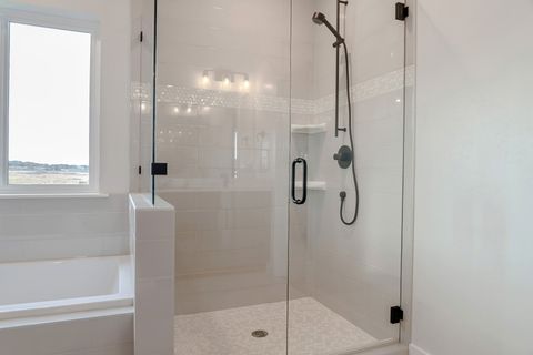 Bathroom shower stall with half glass enclosure - Stevensville, MD - J.T. Mitchell's Glass & Mirror, Inc.