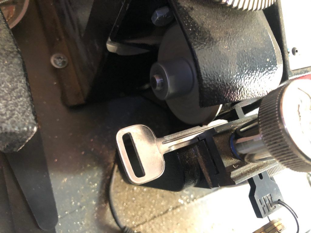 A close up of a key in a machine.