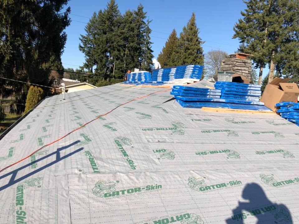 Progress on roof installation, asphalt shingles roof. Charlie Roofing, Olympia Roofer.