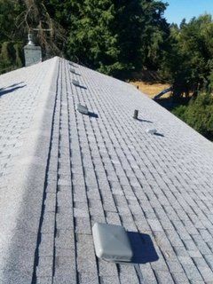 Progress on roof installation, asphalt shingles roof. Charlie Roofing, Olympia Roofer.