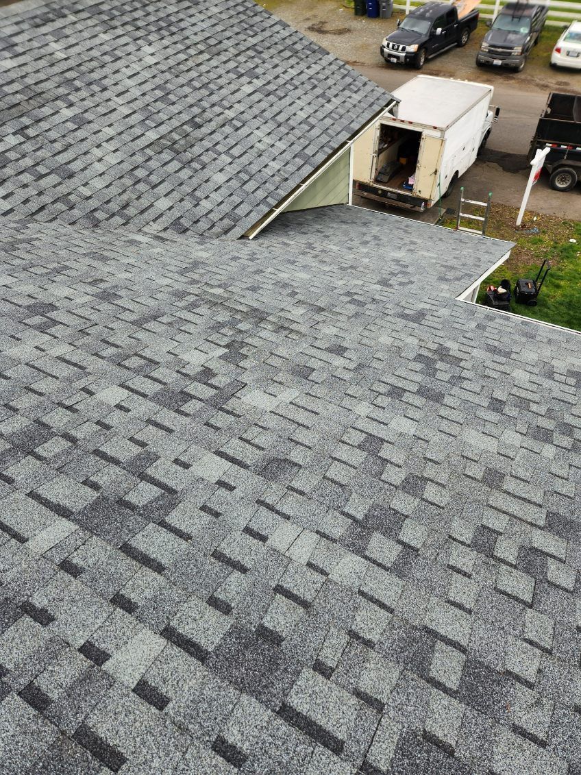 Brand New Roof replacement in Olympia WA, asphalt shingles call Charlie Roofing for quote.