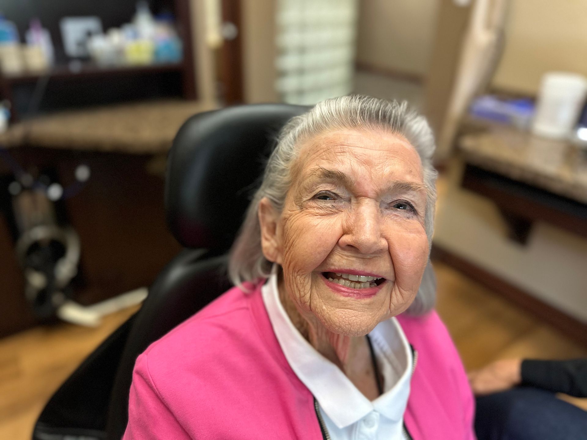 older woman smiling with new front teeth