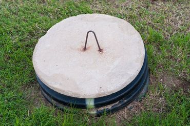 circular lid covering access to septic tank