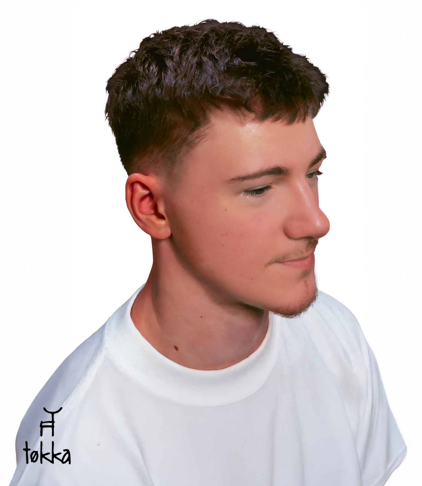 Man with short, dark brown hair and faded sides, wearing a white t-shirt, looking down.