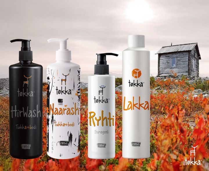 Four bottles of tekka products are lined up in a field