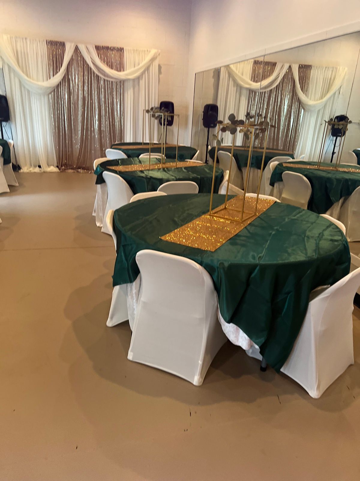 A room with tables and chairs set up for a party.