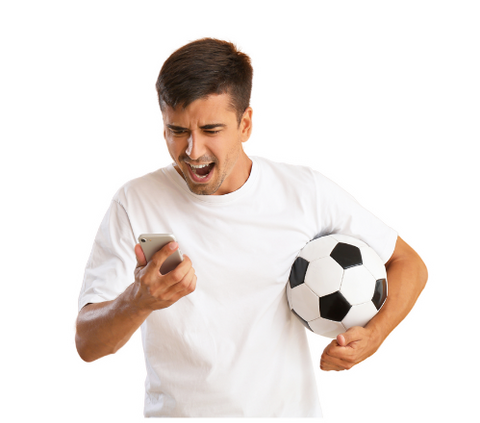 Image of a man holding a phone and a football