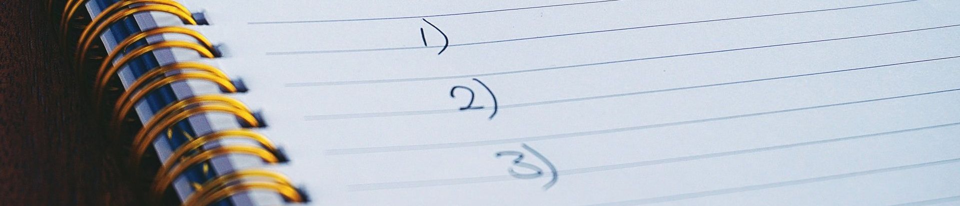 a close up of a spiral notebook with numbers on it 