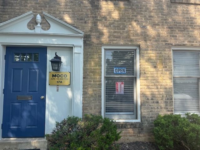 Blue door with sign for MODO and window with Blue door with sign for MODO and window with