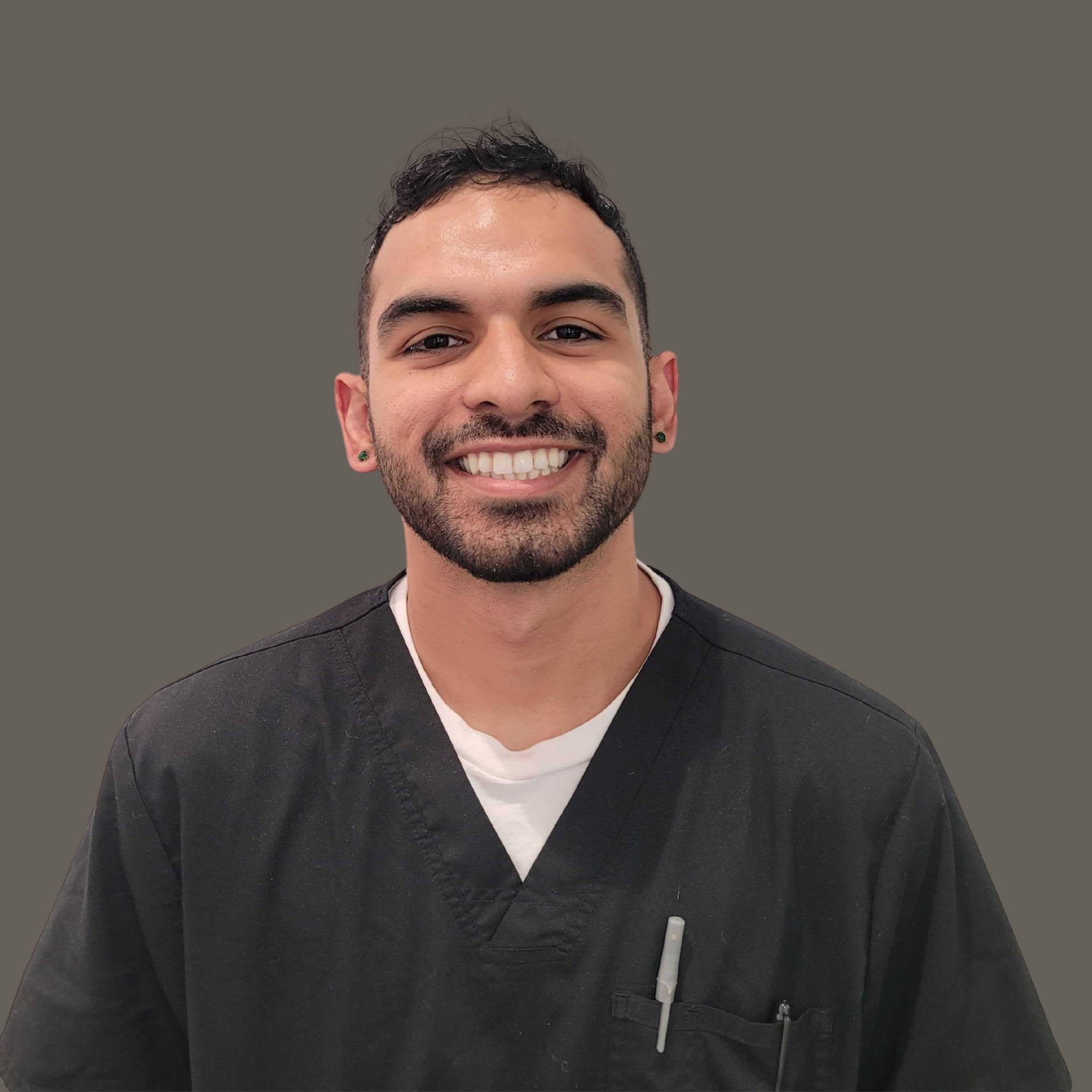 Man smiling against a solid background