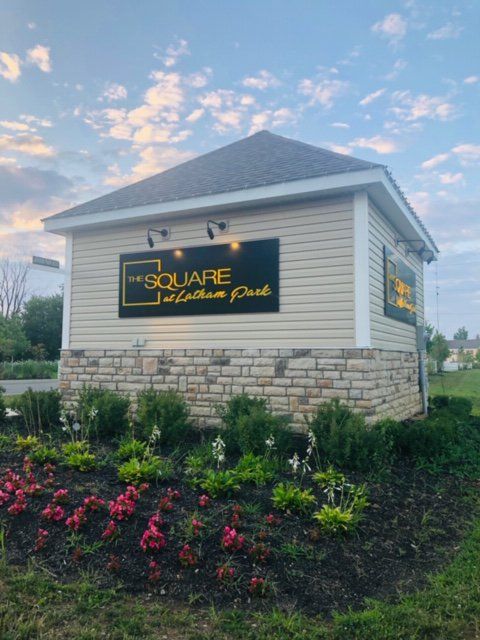 Sign at The Square at Latham Park
