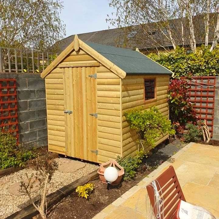 Wooden garden shed with a felt roof