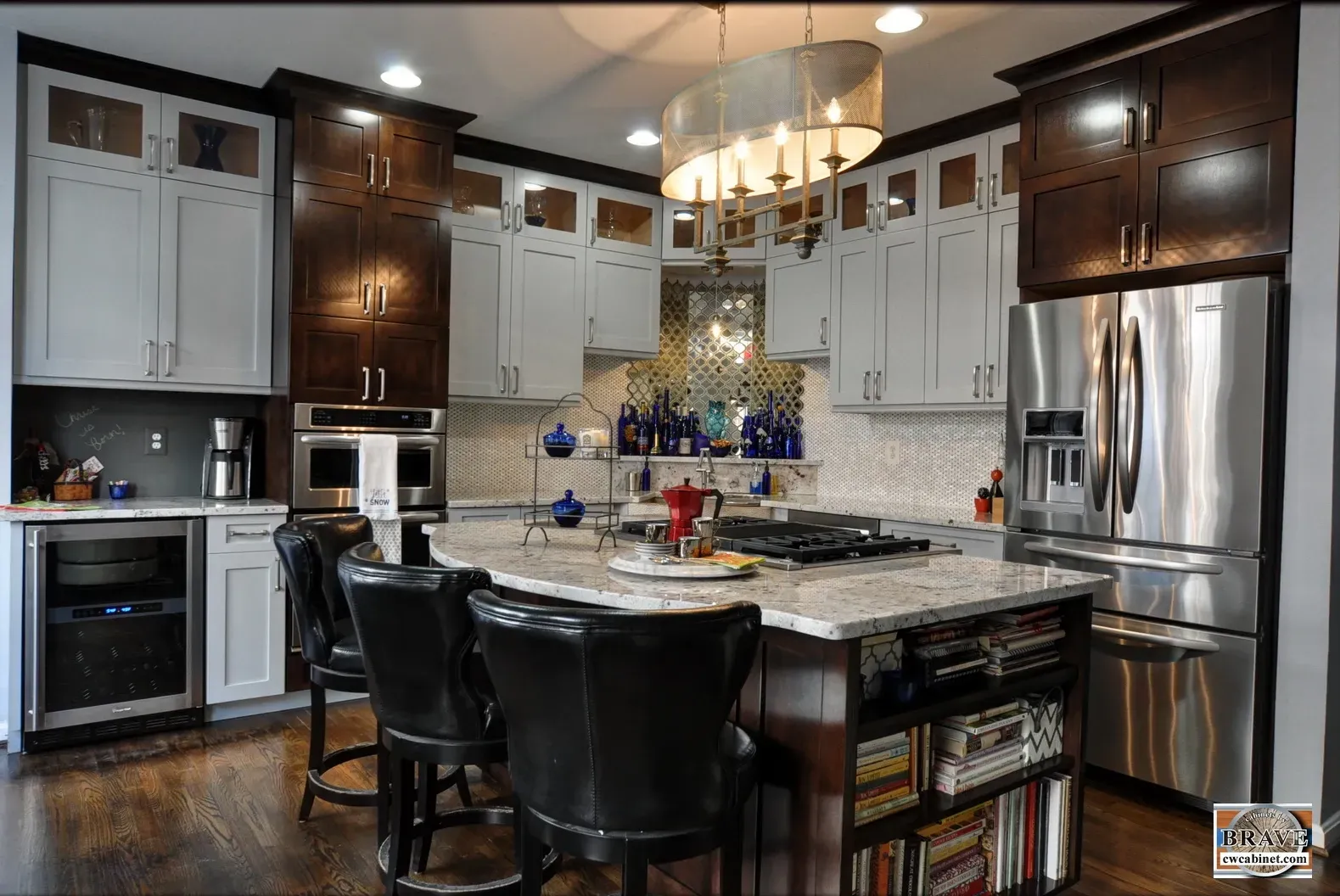 A kitchen with stainless steel appliances and white cabinets