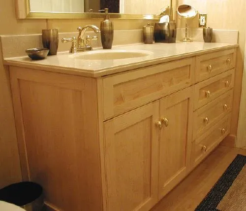 A bathroom vanity with a sink and a mirror