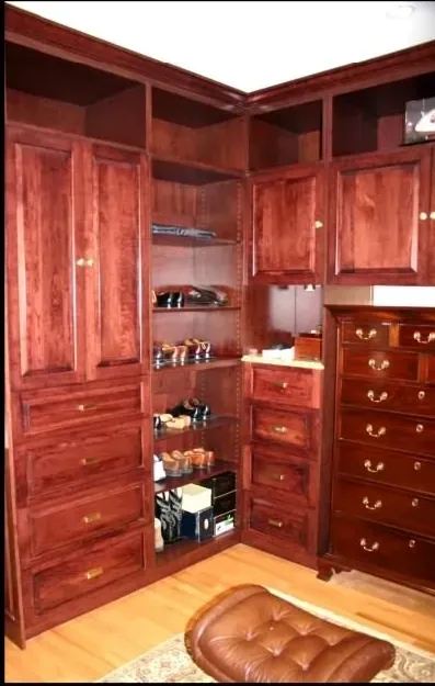 A room with lots of wooden cabinets and drawers