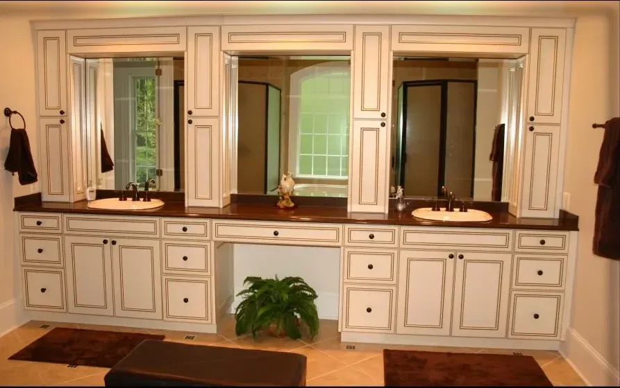 A bathroom with two sinks and two mirrors