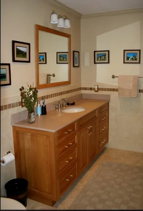 A bathroom with two sinks and a large mirror
