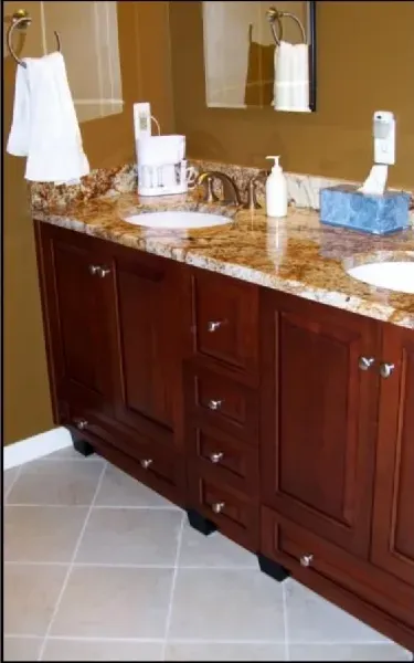 A bathroom with two sinks and a mirror