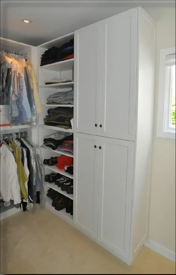 A walk in closet filled with clothes and shoes