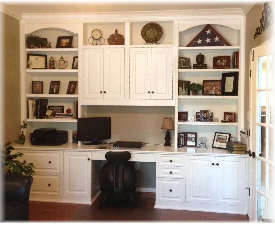 A desk with a computer and a flag on top of it
