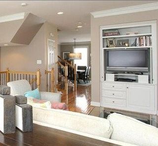 A living room with a couch and a flat screen tv
