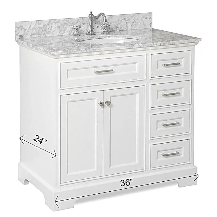 A white bathroom vanity with a marble counter top and a sink.