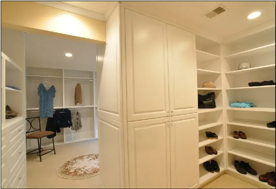 A walk in closet filled with clothes and shoes