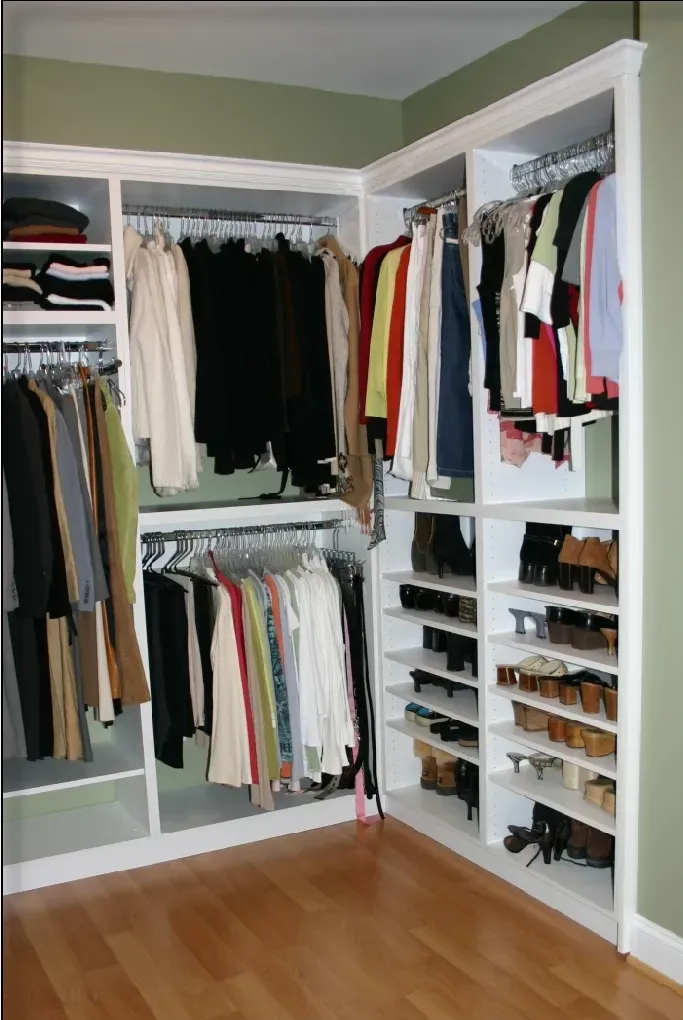 A walk in closet filled with clothes and shoes