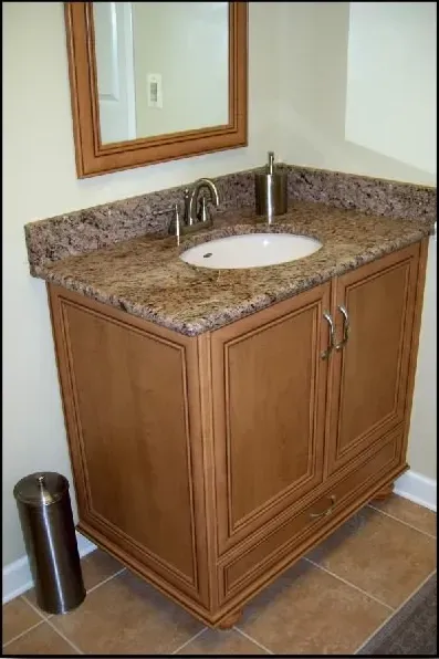 A bathroom vanity with a sink and a mirror
