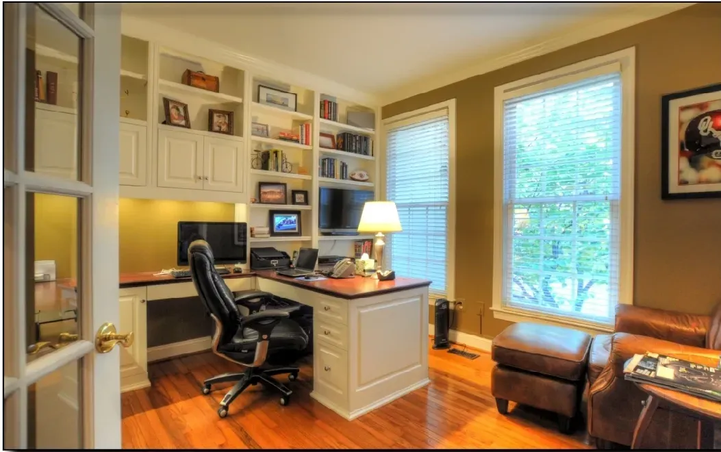 A home office with a desk and a chair