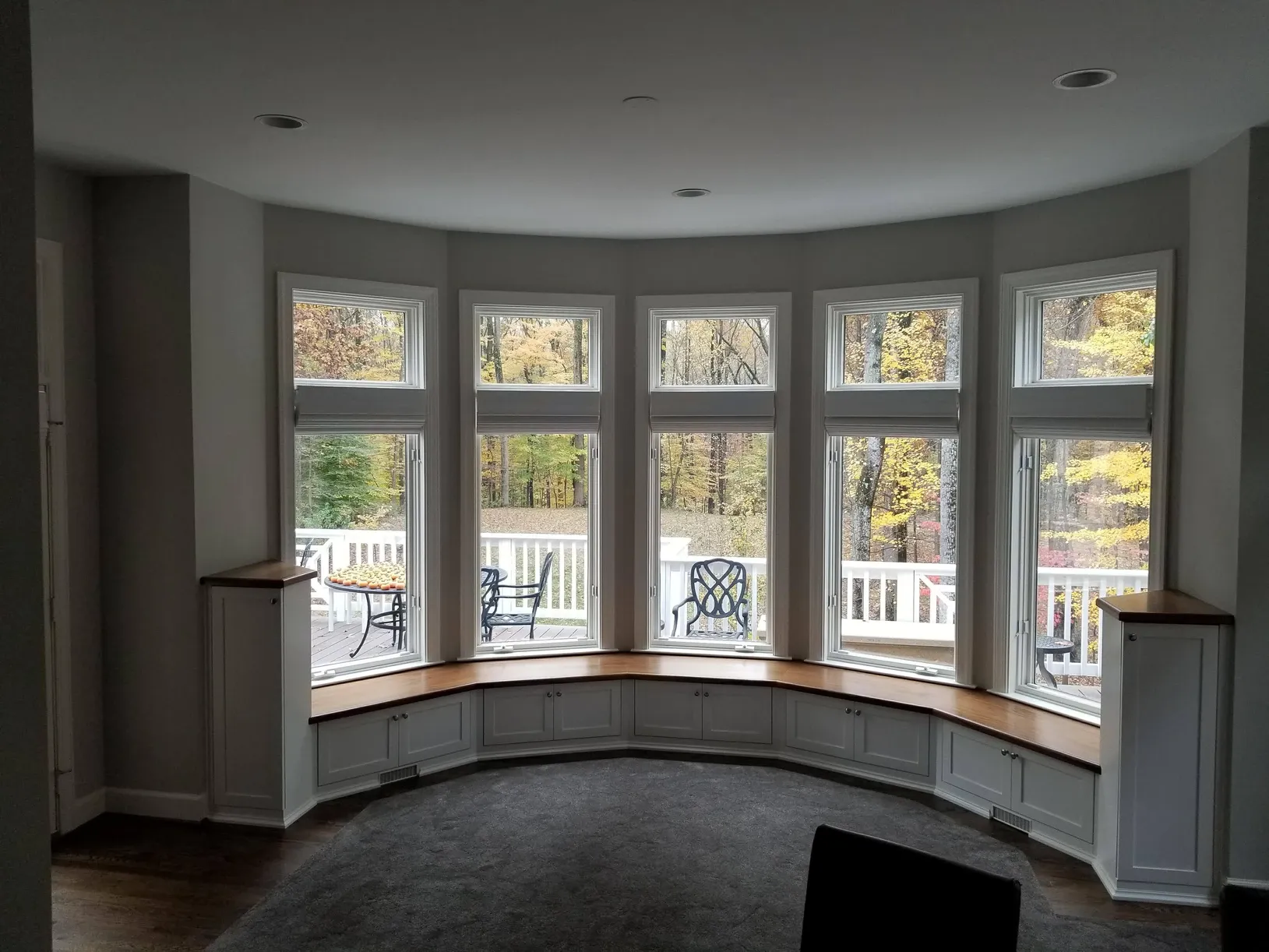 A living room with a large bay window