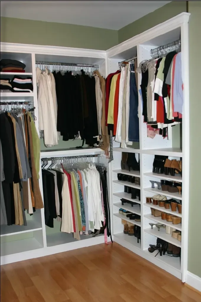 A walk in closet filled with clothes and shoes