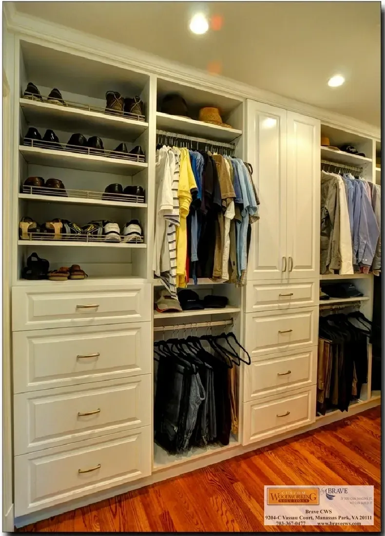 A walk in closet with lots of clothes and shoes