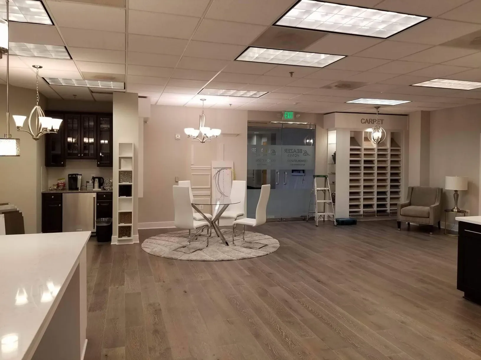 A large room with a table and chairs in it