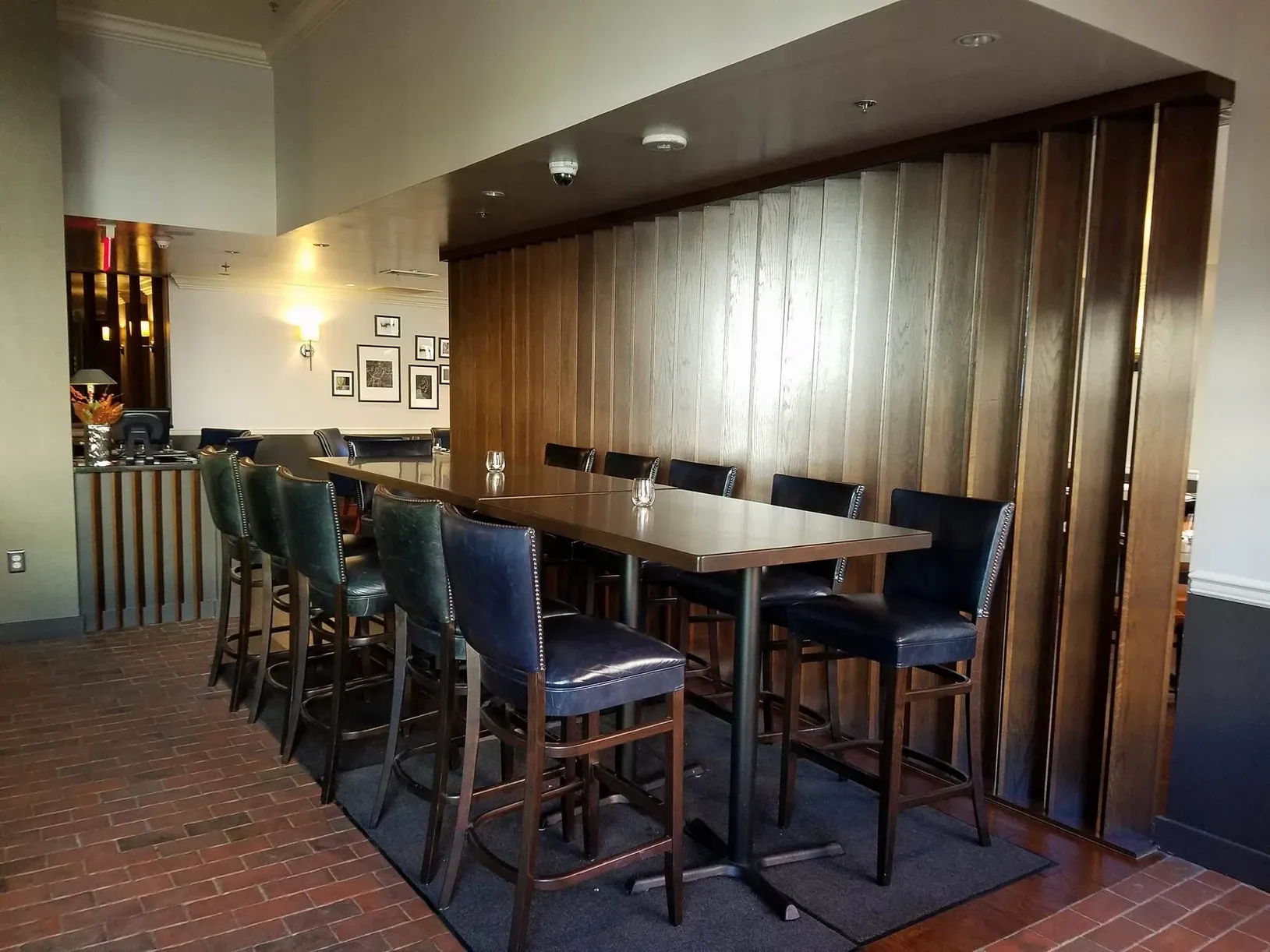 A restaurant with a long table and chairs
